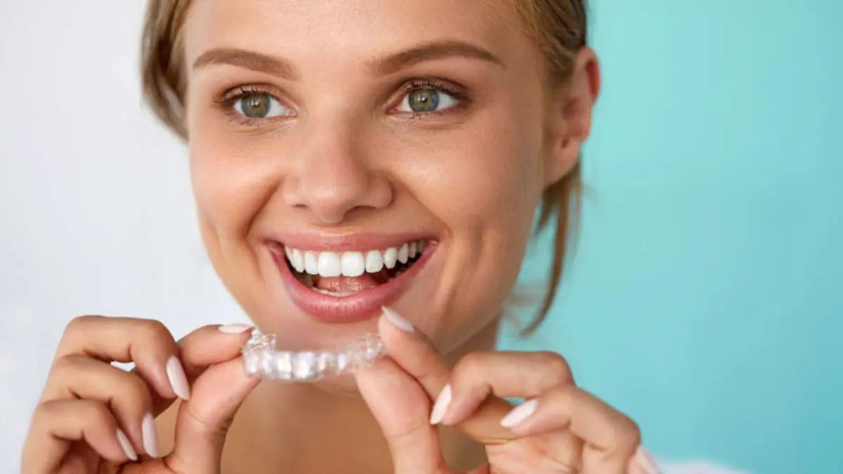 Woman Holding A Clear Invisalign